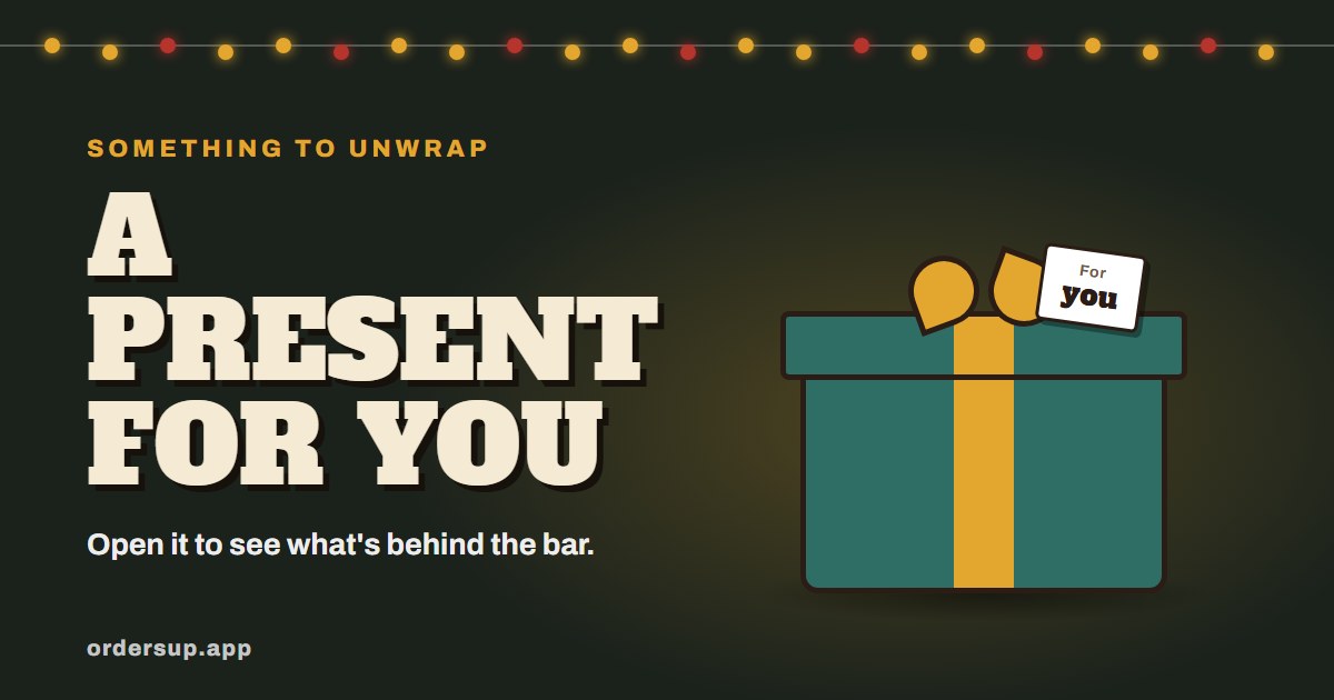 A wrapped teal present with a For you tag under a string of lights, and the words A present for you